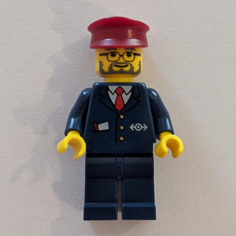 Conductor - Dark Blue Jacket, Dark Blue Legs, Dark Red Hat, Glasses, Beard