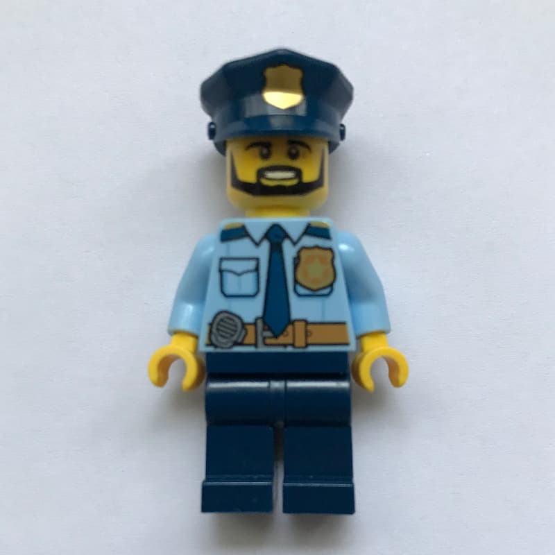 Policeman Captain Ember, Bright Light Blue Shirt with Radio and Badge, Dark Blue Legs, Police Hat with Badge, Beard